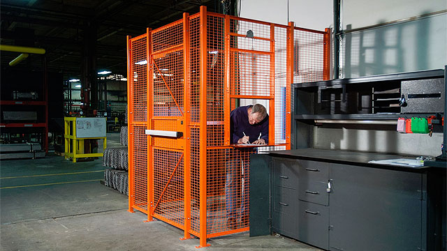 Dock door/driver security cage in a warehouse
