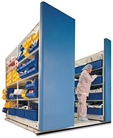 Healthcare worker using mobile aisle shelving to access records