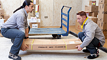 Men Lifting Heavy Load