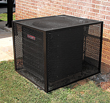 Black metal cage around an outdoor AC unit