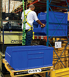 Man placing product in large rack-sized bin