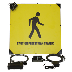 Light-up sign reading Caution Forklift Traffic, with sensor components