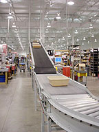 Totes emerging from conveyor overpass at Mouser's enhanced distribution center