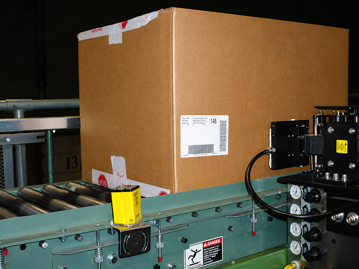 Barcode scanner and label application machine on the conveyor system