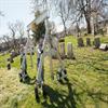 aluminum gantry crane being pushed through a cemetery