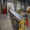 dock area of a warehouse with conveyor leading into a trucking container