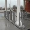 Gray bollards in a banking drive-through