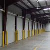 Row of dock doors with yellow bollards
