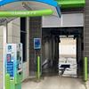 Lime green clearance bar hanging in a car wash
