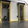 Yellow goal post guardrails in front of open doorways