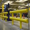 Row of yellow guardrail in industrial facility