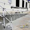 White handrail on outdoor ramp and stairs