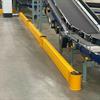 Yellow floor rail next to incline conveyor