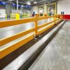 Run of yellow guardrail in a warehouse