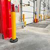 yellow bollards near dock door