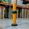 yellow bollard with black ring around mid-height