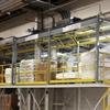 Multiple rolled overhead mezzanine gates installed on a platform