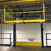 Powered three-sided mezzanine safety gate on platform edge