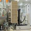 AGV bringing palletized load to machinery