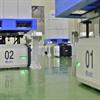 Fleet of AGVs carrying palletized loads