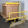 Yellow side railing on pallet rotator