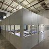 large in-plant office filled with tables and benches