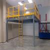 Gray mezzanine with yellow rail and ladder