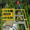 Worker entering safety cage