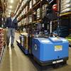 Robotic Pallet Truck with Double Length Forks Passing a Worker