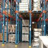 pallets stacked three high in the lower bay of a rack system