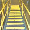 Yellow step covers installed on serrated grating