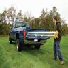 tripod crane being stowed in a truck bed