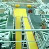 Yellow walkway cover with orange edging installed over metal grating