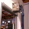 Forklift load about to collide with entry door and wall
