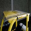 Rigid, long wearing clear forklift cab cover protects operator from falling debris