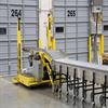 ergonomic conveyor and flexible conveyor in front of warehouse dock doors