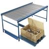 Extended glide-out rack under conveyor with crate of components