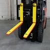 Rubber forklift tine pads and bumpers on a forklift