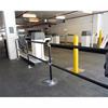 Plastic Sleeved Handrail utilized in a parking garage to protect pedestrians