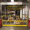 Rolled overhead mezzanine gate loaded with pallets
