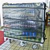 Filled cart rolled into convenience store for re-stocking