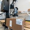 Cobot placing box in first layer on a pallet