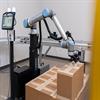 robot placing second layer of cartons on a pallet