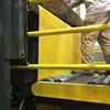 employee using machinery protected by roll-up guard