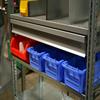 Shelving unit with various containers and dividers.