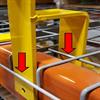 H-shaped yellow bracket slotting over orange beam with wire decking