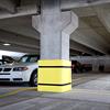 The square parking column protector in use in a parking garage