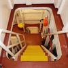 Yellow step covers installed over painted steel stairs inside a vessel