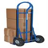 Hand truck loaded with a large stack of boxes.