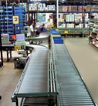 conveyor system for order fulfillment integrated with horizontal carousels